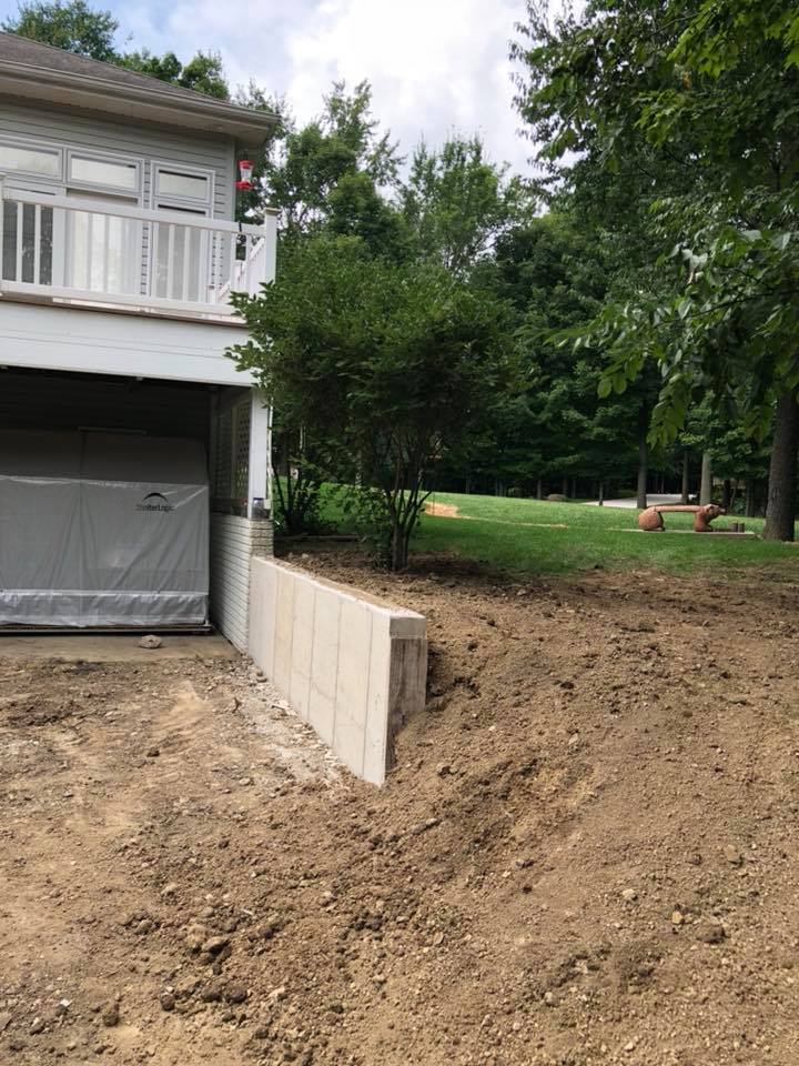 newly added retaining wall at the driveway