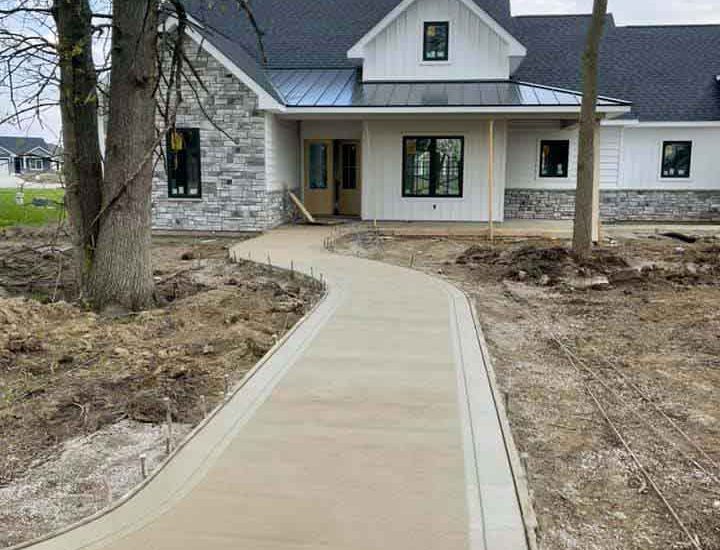 front of the house newly constructed concrete walkway